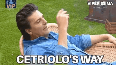 a man in a blue shirt is laying on a wicker chair with the words cetriolo 's way above him