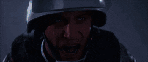 a man wearing a helmet with his mouth wide open