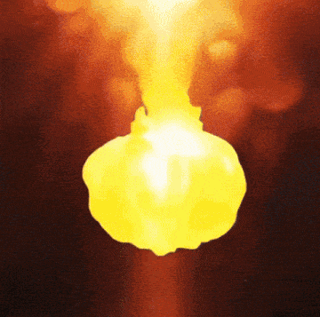 a close up of a yellow object with a red background