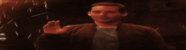 a man in a jacket is standing in front of a fire tunnel .