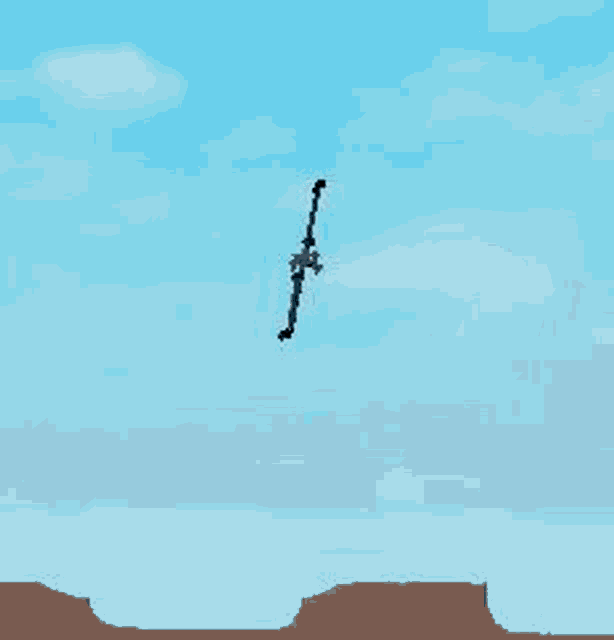 a sword is flying in the sky over a desert .
