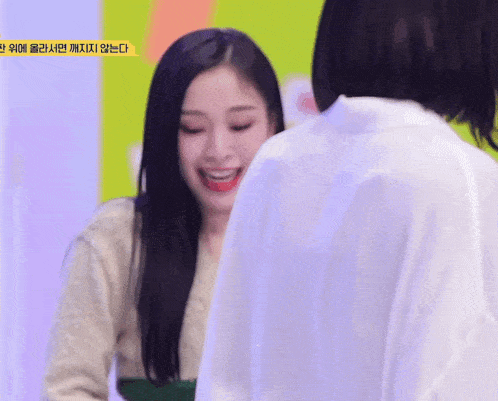 a woman wearing a name tag that says ' eeeee ' on it