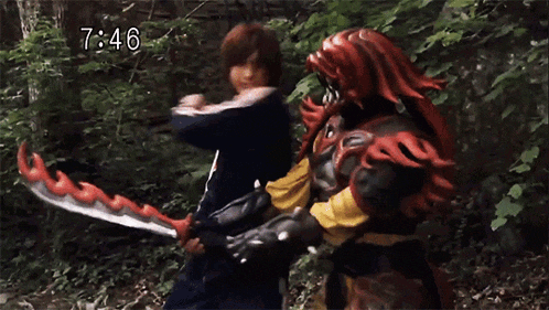 a man is holding a sword in front of a monster with the time 7:46