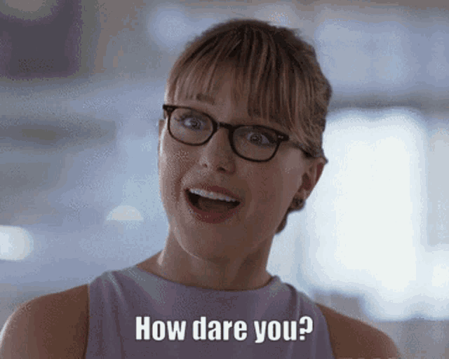 a woman wearing glasses and a purple shirt says how dare you