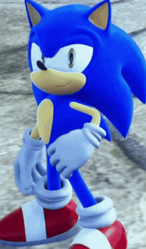 a close up of a sonic the hedgehog standing on the ground