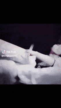a blurry picture of a person 's face with tik tok written on the bottom right