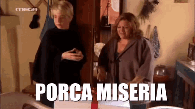 two women standing next to each other with the word porca miseria written on the screen