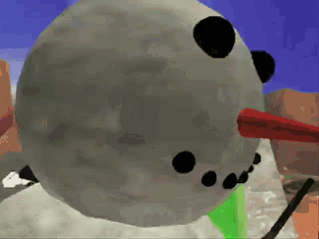 a close up of a snowman with a red nose and black eyes