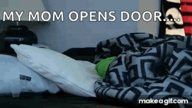 a person is laying on a bed with a blanket and pillows and says `` my mom opens door ... ''