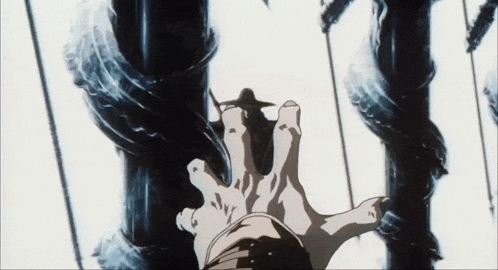 a person 's hand is reaching out towards a snake
