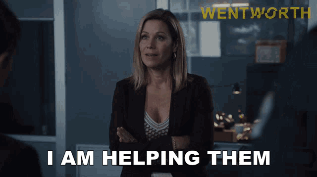 a woman says i am helping them in front of a sign for wentworth