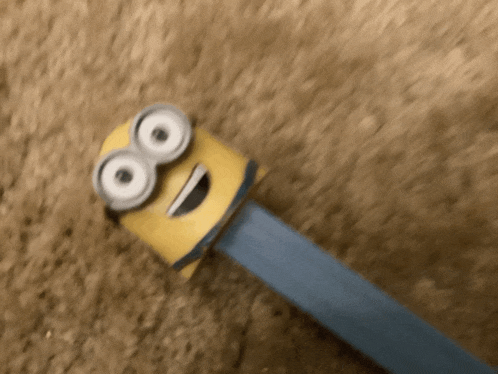 a blurred image of a minion with a big smile on its face