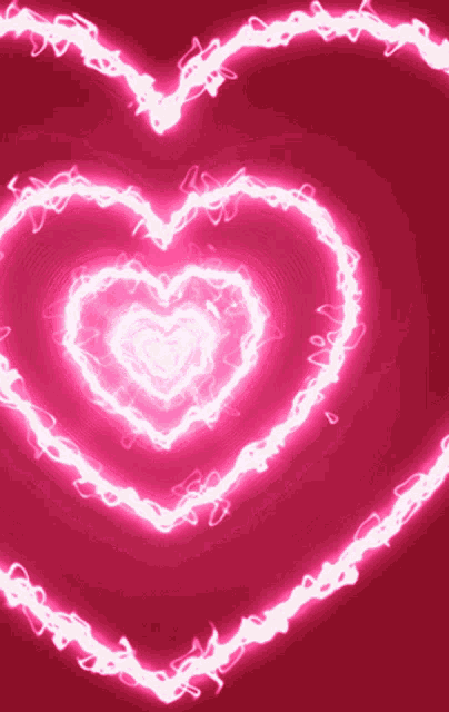 a pink background with a glowing heart shaped pattern