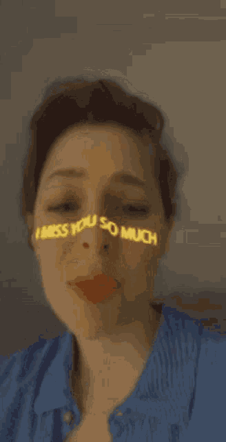 a woman is wearing a mask that says i miss you so much