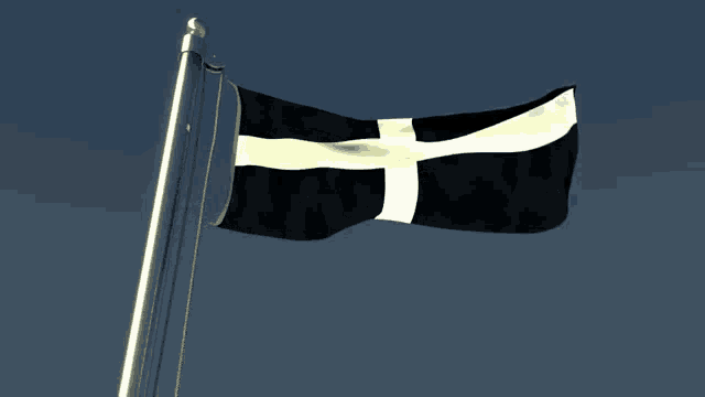 a black flag with a white cross on it is waving in the wind