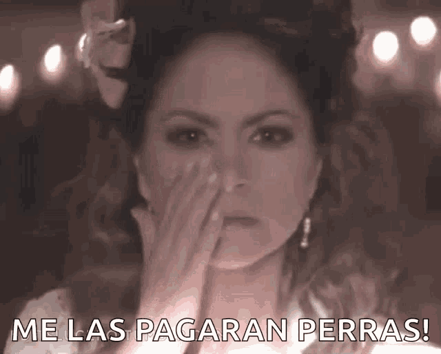 a woman blowing a kiss with the words me las pagaran perras written below her