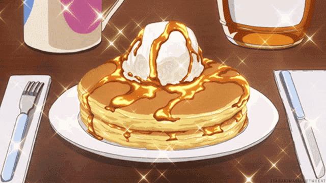a stack of pancakes with ice cream and syrup on top of them