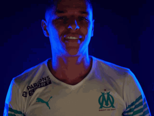 a man wearing a white shirt with uber written on it