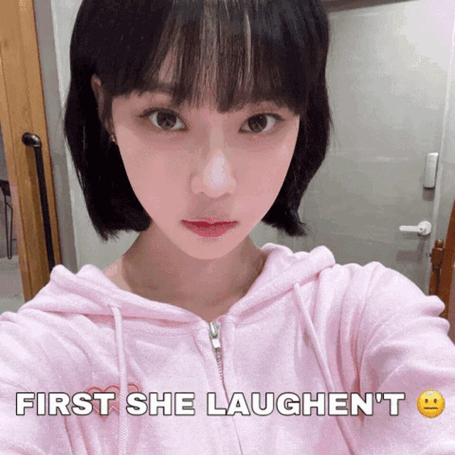 a girl taking a selfie with the words first she laughen 't below her