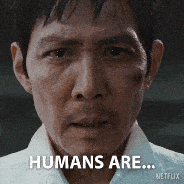 a close up of a man 's face with the words humans are on the bottom right