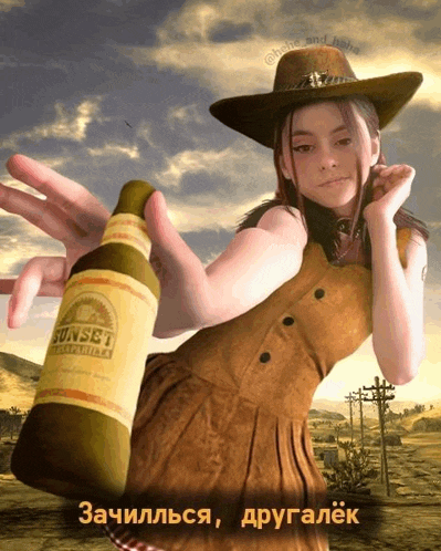 a girl in a cowboy hat holds a bottle of sunset campfire