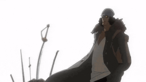 a man wearing a hat and sunglasses is standing in front of a sword
