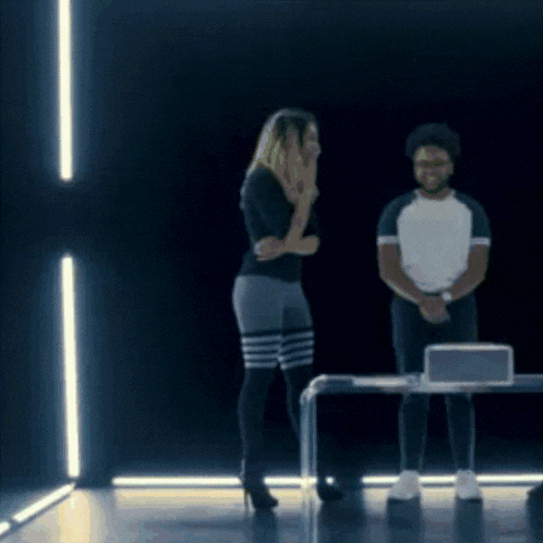 a man and a woman are standing next to each other