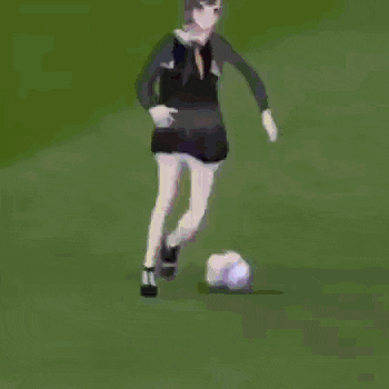 a girl in a skirt is dancing on a basketball court