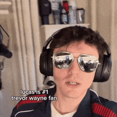 a man wearing sunglasses and headphones with the caption lucas is # 1 trevor wayne fan