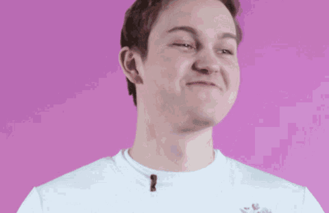 a man wearing a white shirt with the letter n on it