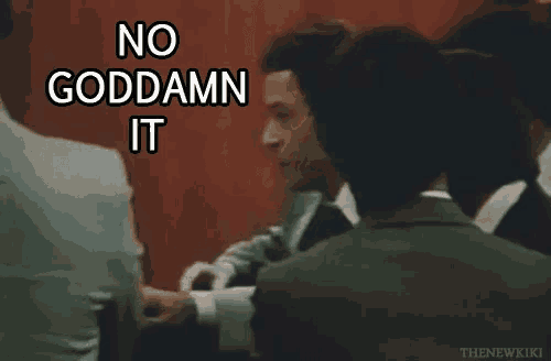 a man in a suit says no goddamn it in front of a group of men