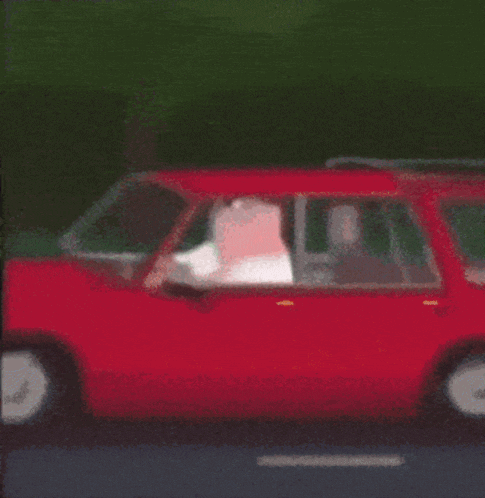 peter griffin from family guy is driving a car and looking out the window