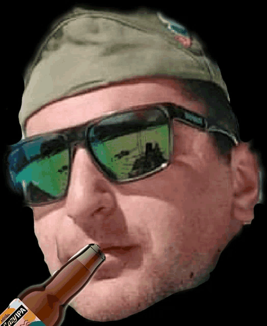 a man wearing sunglasses and a hat holds a bottle of pale ale in his mouth
