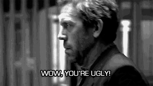 a black and white photo of a man with the words `` wow , you 're ugly '' .
