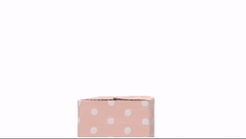 an orange cartoon character with a blue bow on its head is coming out of a cardboard box