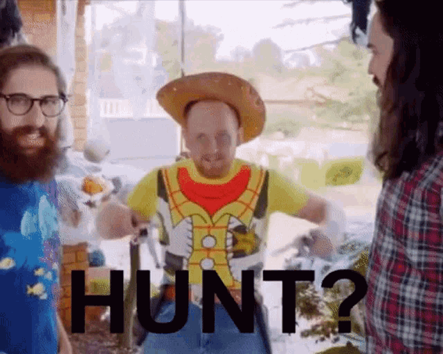 a man wearing a cowboy hat and a shirt that says hunt on it