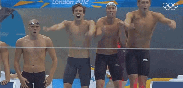 a group of men are standing in front of a banner that says london 2012