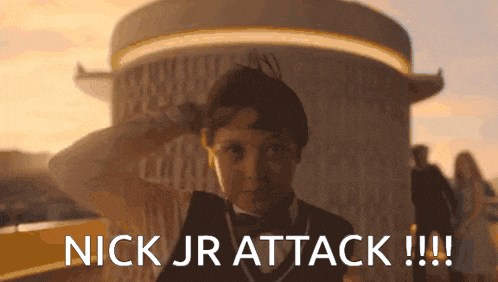 a young boy salutes in front of a building with the words nick jr attack !!! below him