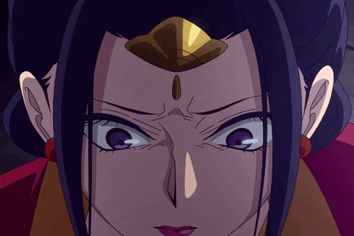 a close up of a woman with purple eyes and a gold crown on her head