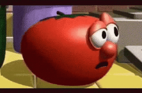 a cartoon tomato with a surprised look on his face .
