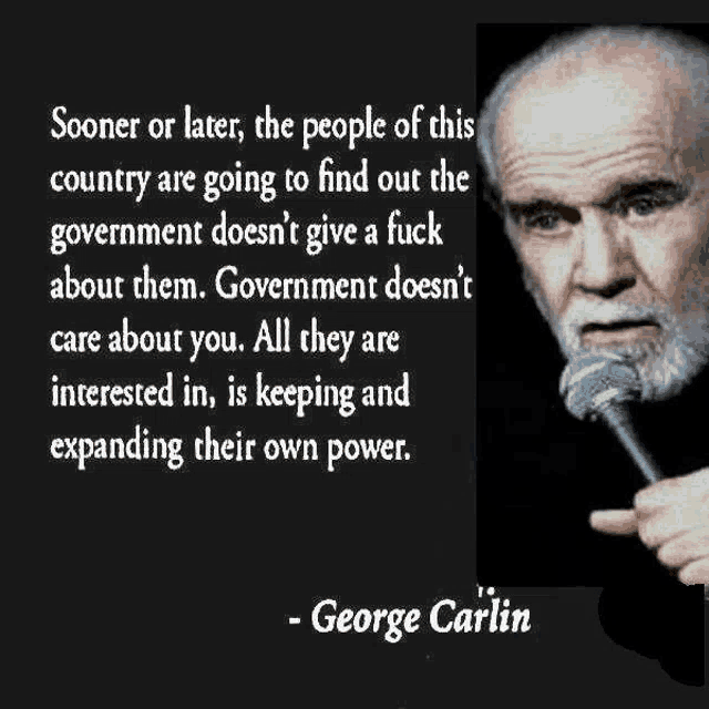 a man with a beard is speaking into a microphone with a quote by george carlin