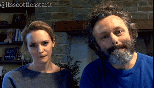 a man and a woman are standing next to each other in front of a stone wall with the words @itsscottiesstark above them