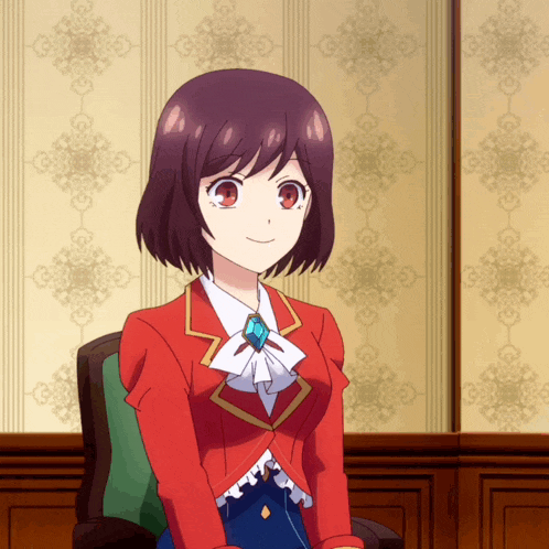 a girl in a red jacket is sitting in front of a wall with a pattern