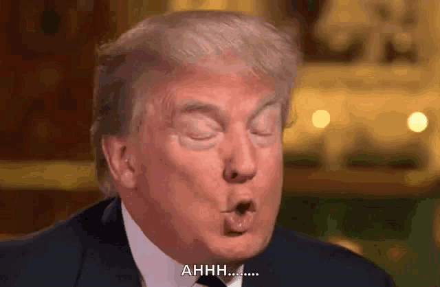 a close up of donald trump making a funny face and saying " ahhh "