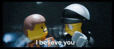 a lego man talking to a police officer with the words i believe you below him