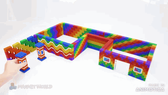 a model of a house made out of magnets with the words made in animatica on the bottom