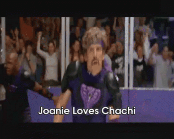 a man in a purple outfit is standing in front of a crowd with the words joanie loves chashi on the bottom