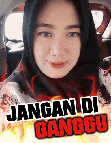 a woman in a hijab is sitting in a car with jangan di ganggu written on the bottom