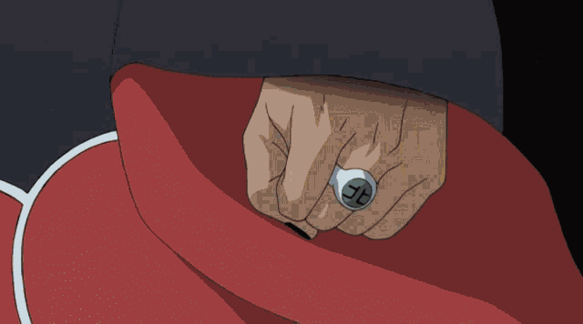 a close up of a person 's hand with a ring that has the letter j on it