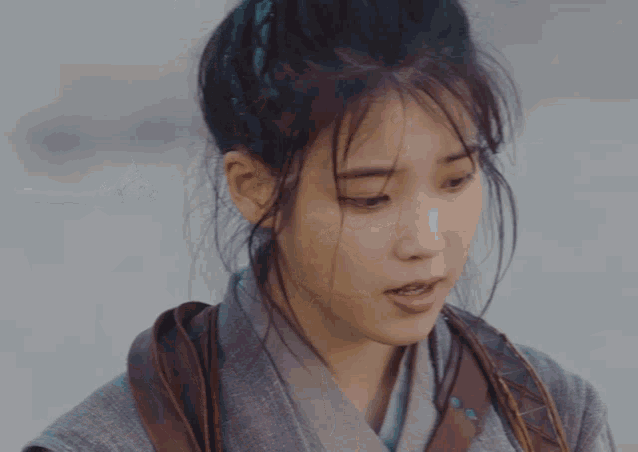 a close up of a woman 's face and hair